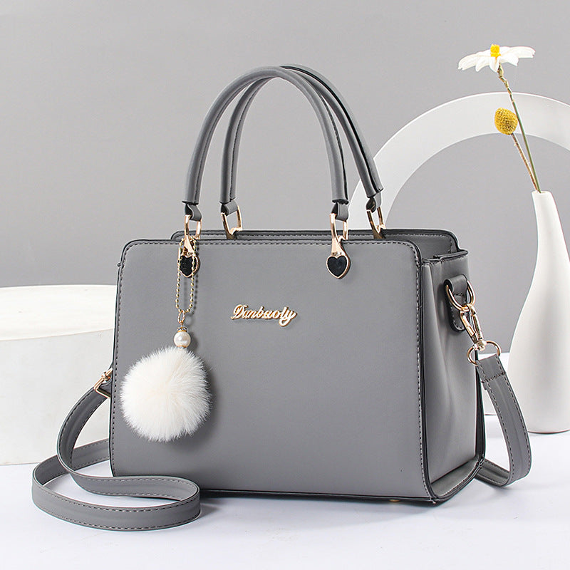 Elegant Faux Leather Handbag with Tassel