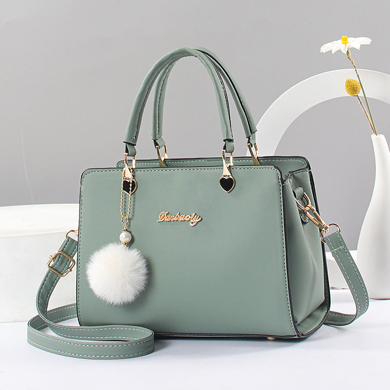 Elegant Faux Leather Handbag with Tassel